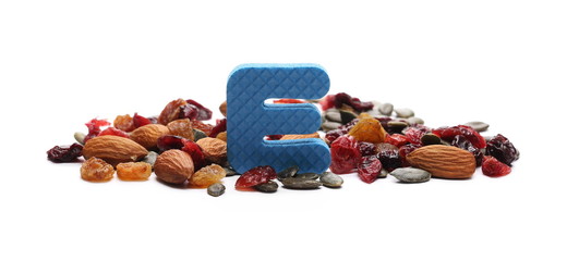 Fototapeta na wymiar Power mix, dry blueberries, cherries, raisins, pumpkin seeds and raw almonds with letter, symbol E isolated on white background 