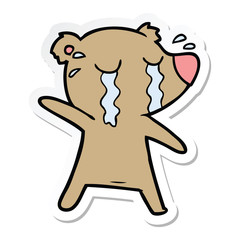 sticker of a cartoon crying bear
