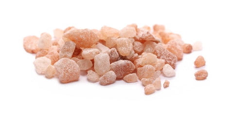 Himalayan salt grains isolated on white background
