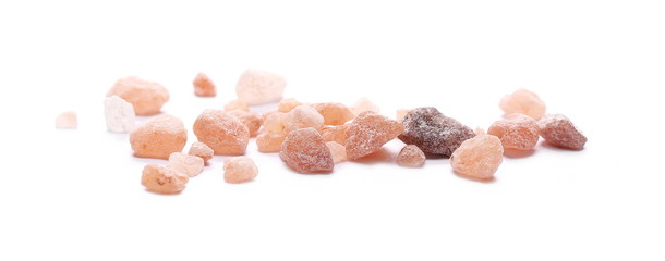 Himalayan salt grains isolated on white background