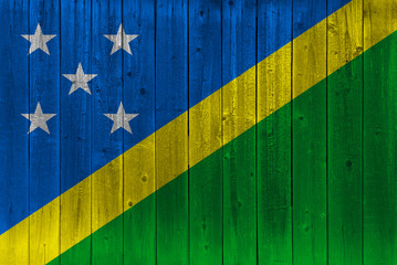 Solomon Islands flag painted on old wood plank
