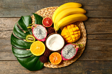 Assortment of exotic fruits on wooden table