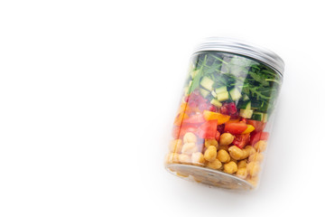 Healthy salad with chickpeas and arugula in a jar on white background. Take away easy lunch concept