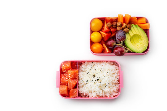 Creative Layout With Healthy Lunch Dishes Variety In Bento Boxes On Wooden Table. Sandwich, Slad With Grains And Pomegranate Seeds, Salmon With Rice And Fruit Snacks. Office Or School Lunch Concept