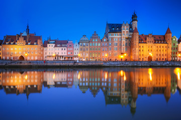 Fototapeta na wymiar Beautiful old town of Gdansk reflected in Motlawa river at dawn, Poland