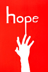 Obraz premium human's hand reaching out for help on red background with letter of 