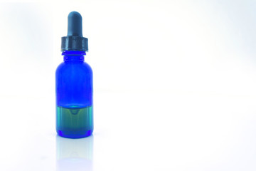 essential oil bottle isolated on white with clipping path