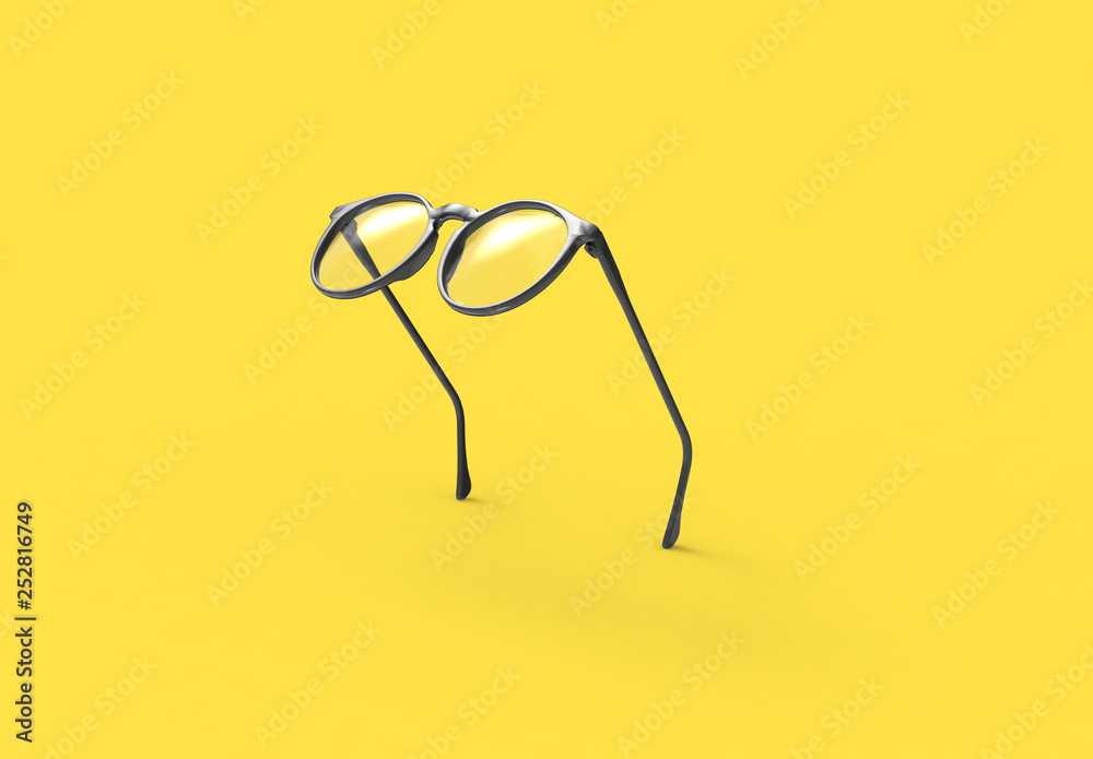 Wall mural studio shot of flying black glasses on yellow background