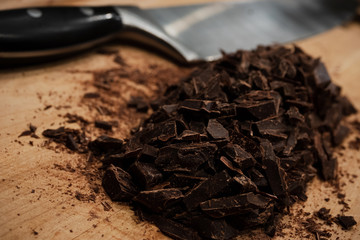 pieces of chocolate on wooden background
