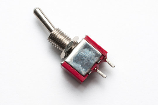 SPST electronic switch component isolated on white background