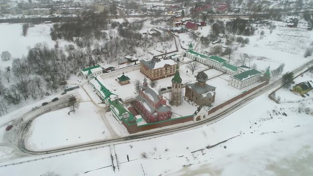 View of the old Ladoga Nicholas monastery, cloudy February day (aerial video). Staraya Ladoga, Russia