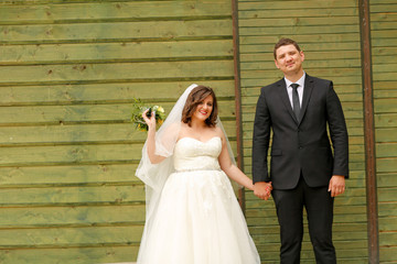 Fototapeta premium Beautiful wedding couple posing outdoor