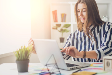 Young perspective web designer and blogger in modern office