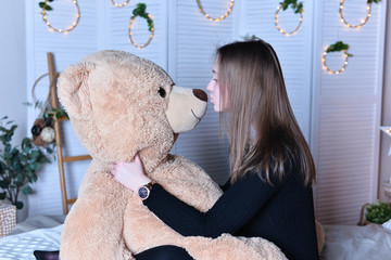 young girl with teddy bear