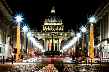 Night street leading to St. Peter's Basilica, illuminated by the light of lanterns. Rome. Italy.