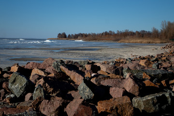 Stony coast of a reservoir with big boulders