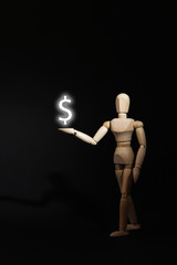 A wooden mannequin shows with his hand. The concept of pointing at someone with your finger. The mannequin will stretch out his hand. Wooden man concept. Wooden mannequin