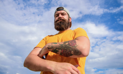 Lumbersexual tattooed well groomed hipster. Hipster with mustache and long beard. Too serious right...