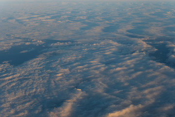 Obraz na płótnie Canvas Flight scene plane window view clouds sunset