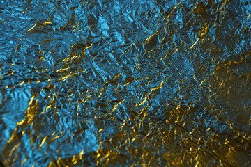 abstract background metal aluminum foil blue and yellow gold color