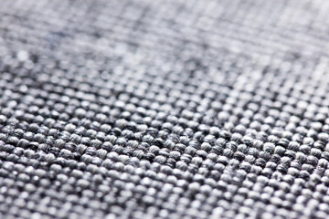 Brown and gray background with chess pattern, closeup. Structure of the multicolor fabric macro.