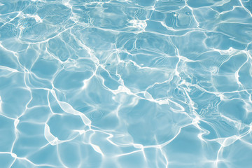 Texture of water in swimming pool for background
