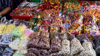 Assartements of asian candies in the vietnamese market .different kinds of sweets in the local market