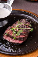 Grilled beef steak on frying pan