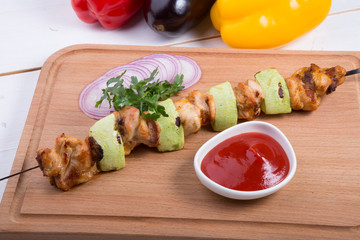 Grilled meat with zucchini on a skewer