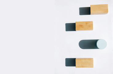 Wooden blocks.Individuality and uniqueness concept.  Light and shadow of Wooden blocks on white background.