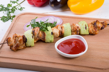 Grilled meat with zucchini on a skewer