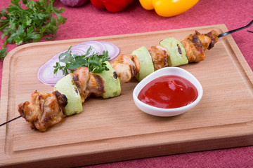 Grilled meat with zucchini on a skewer