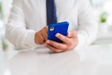Close up of business man hands using smarpthone