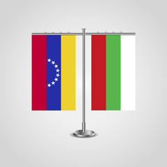 Table stand with flags of Venezuela and Bulgaria. Two flag. Flag pole. Symbolizing the cooperation between the two countries. Table flags