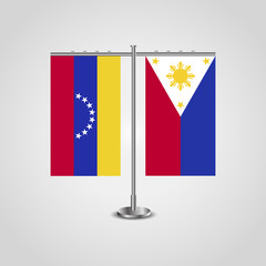Table stand with flags of Venezuela and Philippines. Two flag. Flag pole. Symbolizing the cooperation between the two countries. Table flags