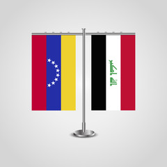 Table stand with flags of Venezuela and Iraq. Two flag. Flag pole. Symbolizing the cooperation between the two countries. Table flags
