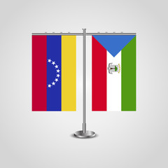 Table stand with flags of Venezuela and Equatorial Guinea. Two flag. Flag pole. Symbolizing the cooperation between the two countries. Table flags
