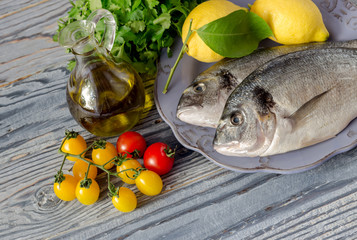 Fish sea breams(Sparus aurata) on a plate close-up.