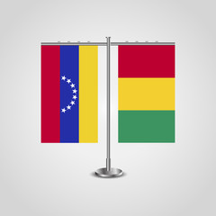 Table stand with flags of Venezuela and Guinea. Two flag. Flag pole. Symbolizing the cooperation between the two countries. Table flags