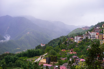 Fototapeta na wymiar Landscape view of valley, village and paddy fields in Sapa