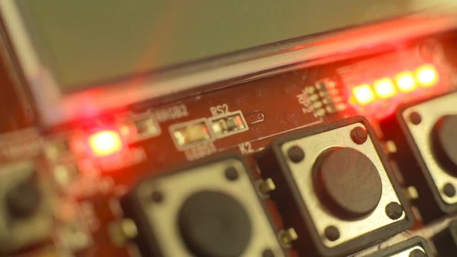 The LEDs are lit and flash to different colors. Close-up.