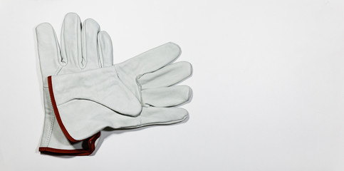 Pair of white glove on white wooden plank, DIY Concept.