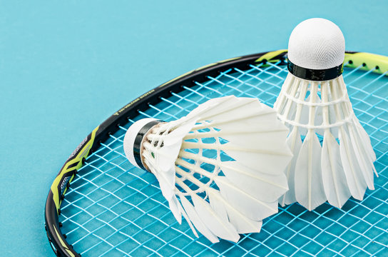 Close up shuttlecock and badminton racket.