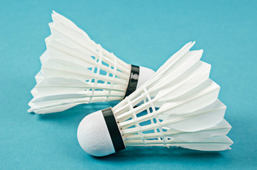 Fototapeta na wymiar Badminton shuttlecocks on blue court.