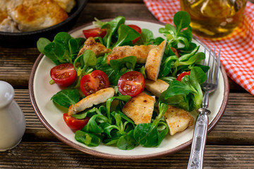 Fresh lettuce corn salad with cherry tomato and grilled chicken