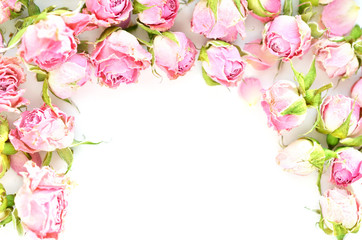 Flowers composition. Frame made of dried rose flowers on white background. Space for text.