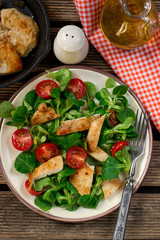 Fresh lettuce corn salad with cherry tomato and grilled chicken