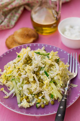 Fresh salad of napa cabbage with cucumbers and peas