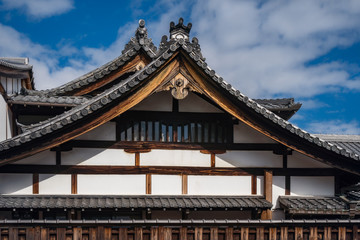 Roof detail with the specific roof tiles of a traditional Japanese Shrine complex in Gion, Kyoto, Japan.