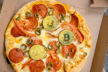 Bitcoin Pizza Day 22 May. Cryptocommunity holiday. concept of buying pizza with bitcoin.